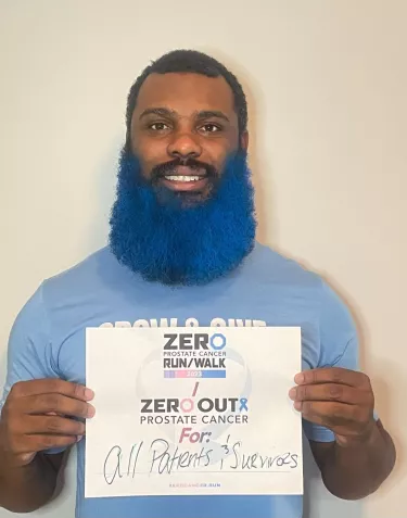 Young African American man, Josh Woods, with a blue beard
