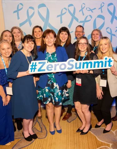 Group of ZERO staff members holding a 'End Prostate Cancer' sign