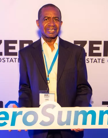 African American man holding a sign ZERO Summit