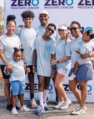 A group of people smiling in front of the ZERO step-and-repeat at the Houston Run/Walk 2023