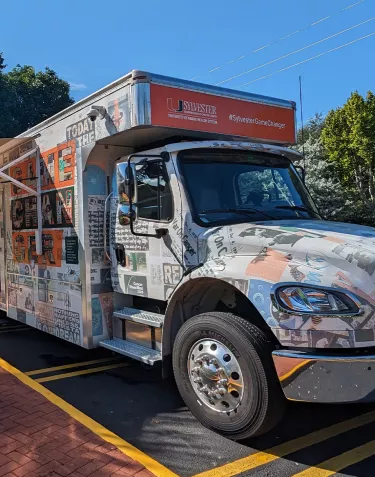 The PSA screening bus owned by Miami University's Sylvester Cancer Center parked outside the ZERO Education event in Miami in 2023