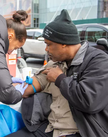 A man holding his sleeve up