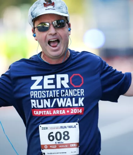 Man in a blue t-shirt participating in ZERO 2014 RunWalk