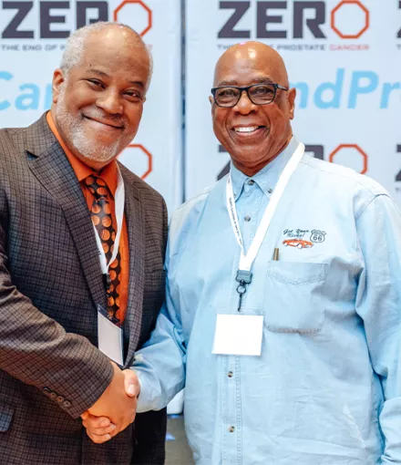 Two men shake hands at ZERO Summit 2020