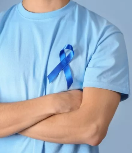 Man Wearing A Blue Ribbon For Prostate Cancer