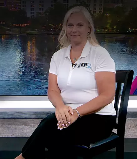 Chapter Manager Tracy Cameron sitting with a reporter