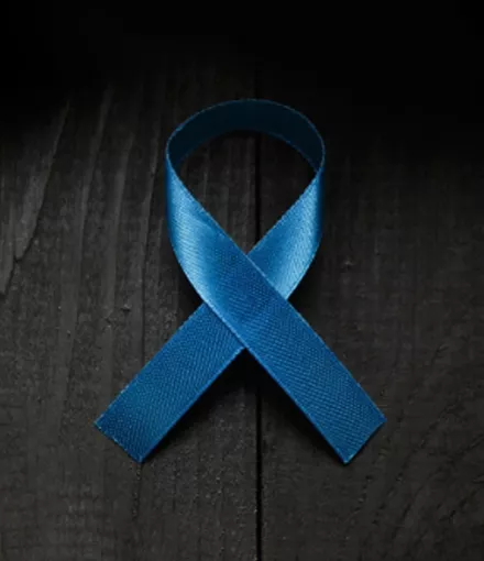 Blue ribbon on black wood