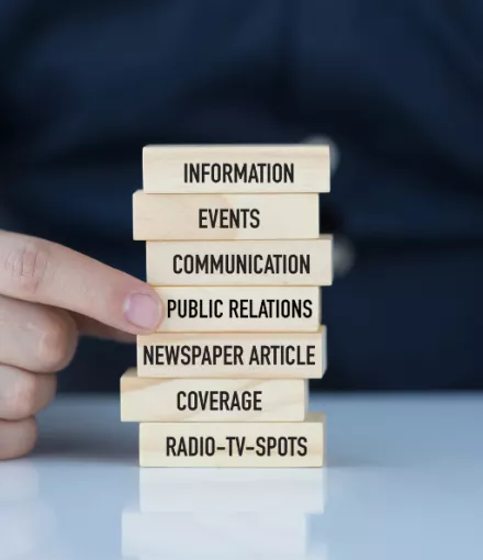 A stack of jenga with different media terms