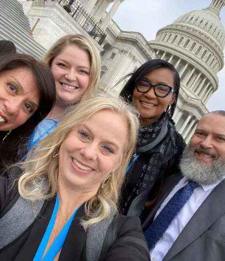 Group pf people in front of the Capitol