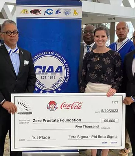 Presentation of fundraising check from Phi Beta Sigma