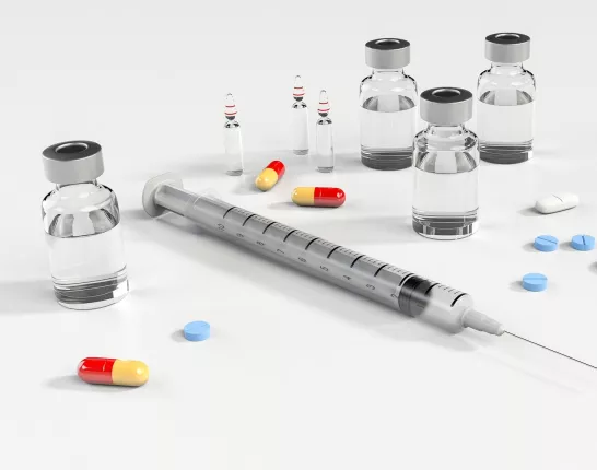 A selection of sterile medical supplies and generic pills on a white background