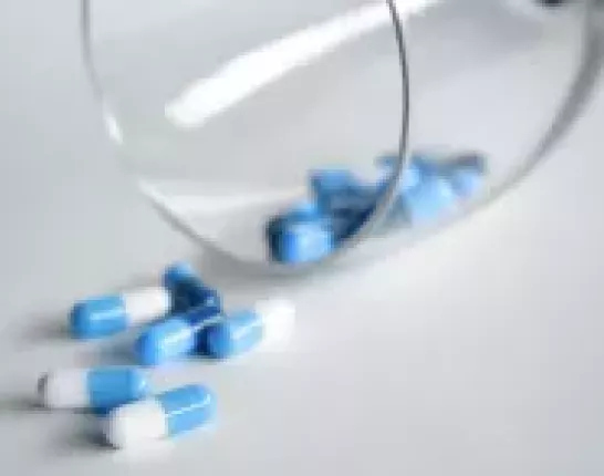 Pill spill out of glass