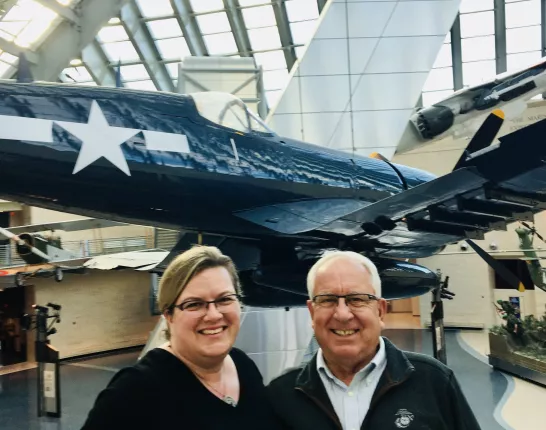 Shawn and her father at the US Marine Corps Memorial Museum in front of a fighter jet