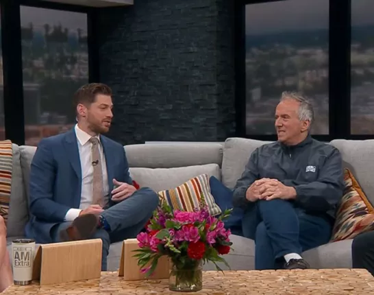 ZERO Champion Ted Healy sitting on the couch with a reporter from KOIN news