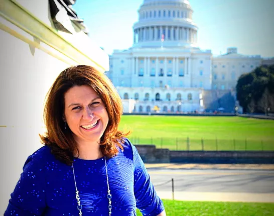 Stephanie Mueller at Capitol Hill in a bright blue dress