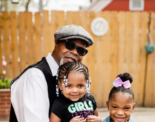 CC Williams with his granddaughters in Detroit
