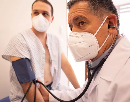 A Doctor Measuring His Patient's Blood Pressure Using a Sphygmomanometer