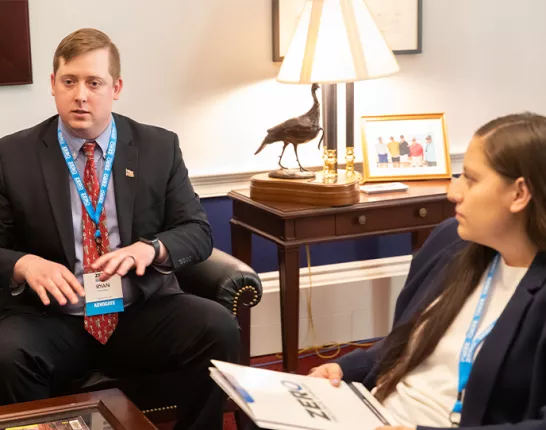 Two advocates sitting in a room at the Capitol 