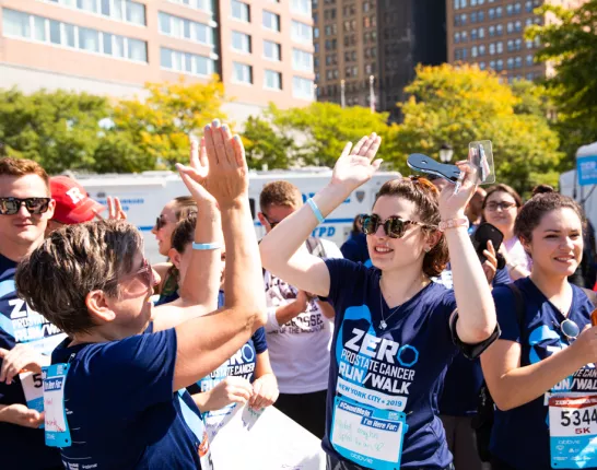 A group of people doing high-fives 