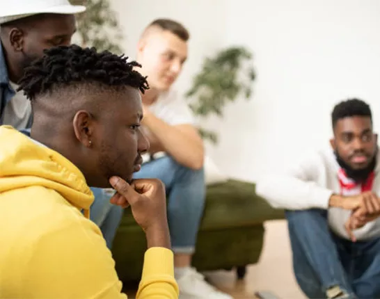 A group of Black men at a support group