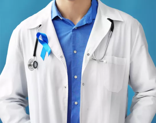 A doctor wearing a blue ribbon