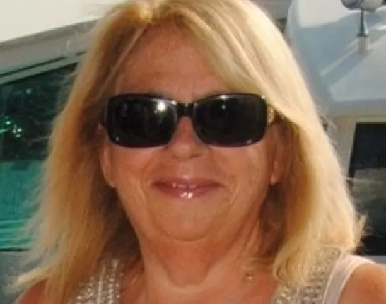 Woman with blond hair and dark sunglasses, Cheryl Nikituk