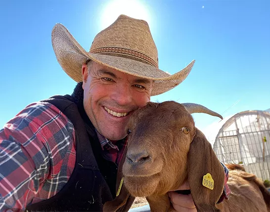 Cowboy Max and a goat