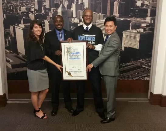 Elected Council Members display a formal proclaimation of committment to address prostate cancer