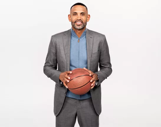 NBA All-Star Grant Hill holding a basketball