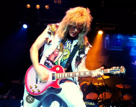 Jay Jay French playing guitar on stage