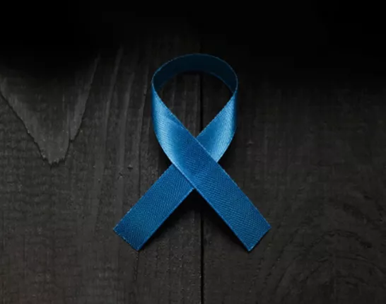 Blue ribbon on black wood