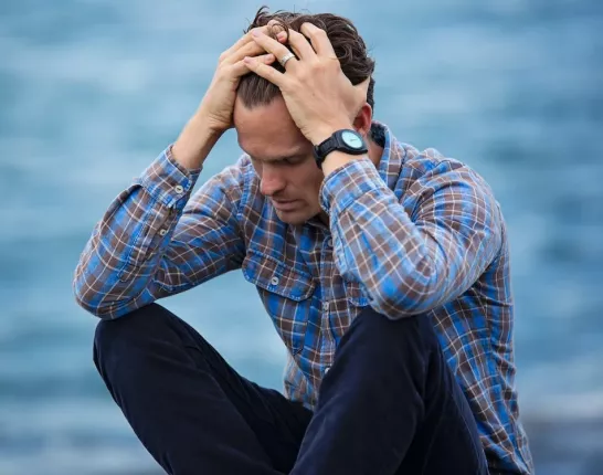 Stressed Man Sitting by the Water