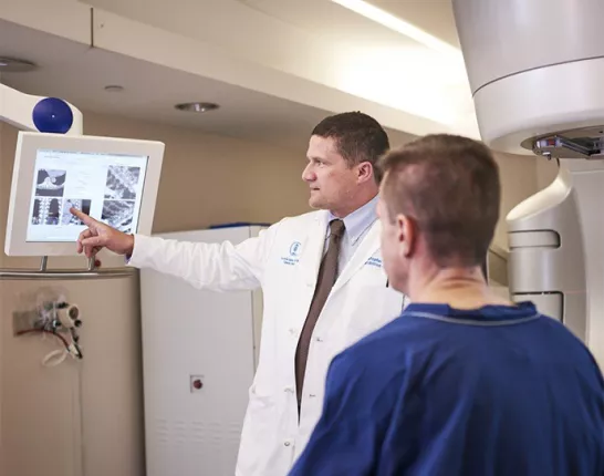 Doctor and patient looking at radiation imaging