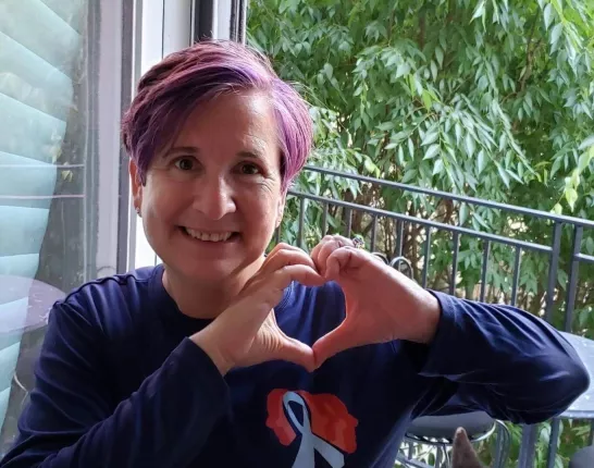 Bogdanos Shirt making a heart with her hands