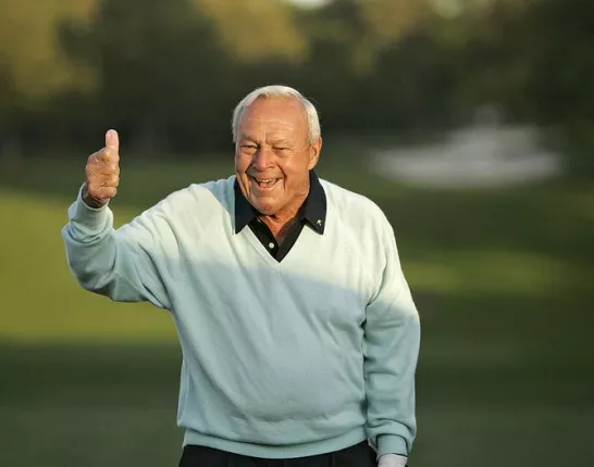 Arnold Palmer giving a thumbs-up sign