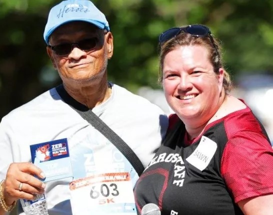Woman and man in sports gear at an event