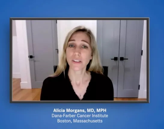 Dr. Alicia Morgan, Blonde woman on video, wearing a black long sleeve shirt