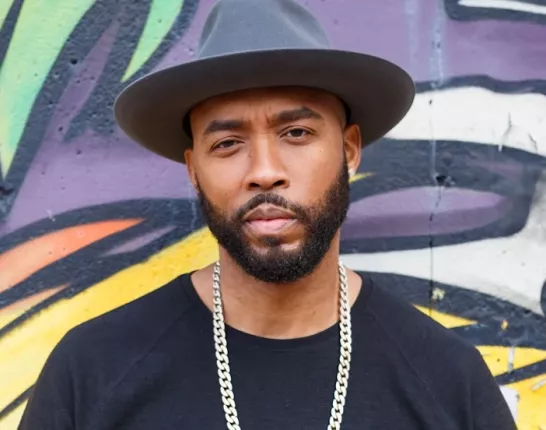 Montell Jordan Standing in Front of Mural