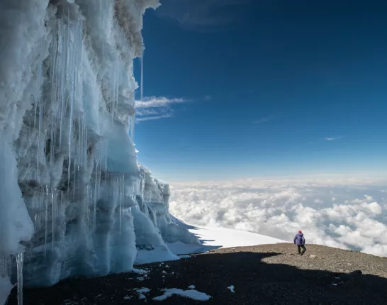 Icy mountain side with hiker