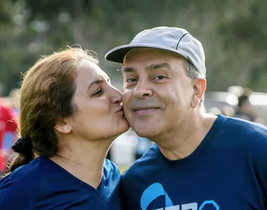 woman kissing man on the cheek