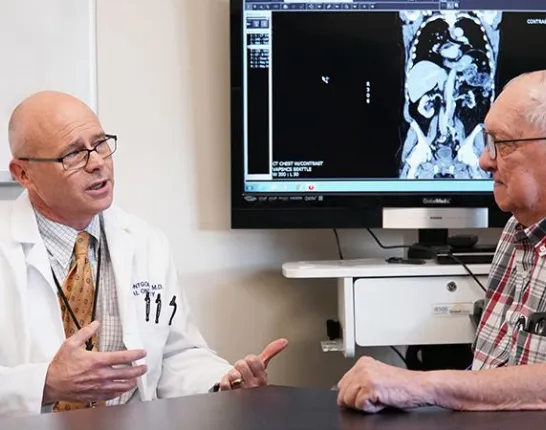 Man talking with a doctor in a medical office