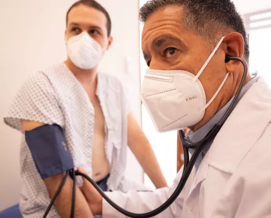 A Doctor Measuring His Patient's Blood Pressure Using a Sphygmomanometer