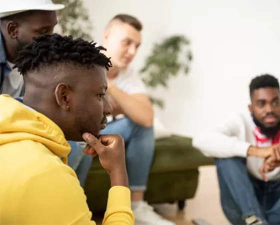 A group of Black men at a support group