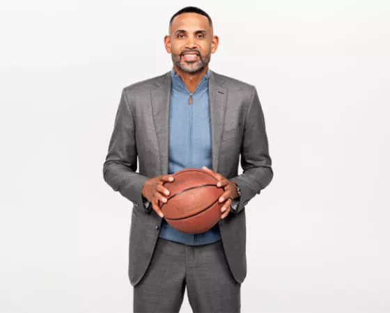 NBA All-Star Grant Hill holding a basketball