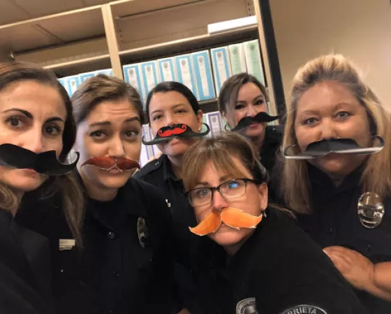 Murrietta Police Department female police officers wearing fake mustaches in support of Grow & Give campaign