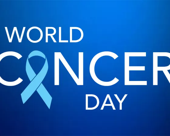 Blue background with the words "World Cancer Day", with a blue prostate cancer ribbon replacing the "a" in the word "cancer"