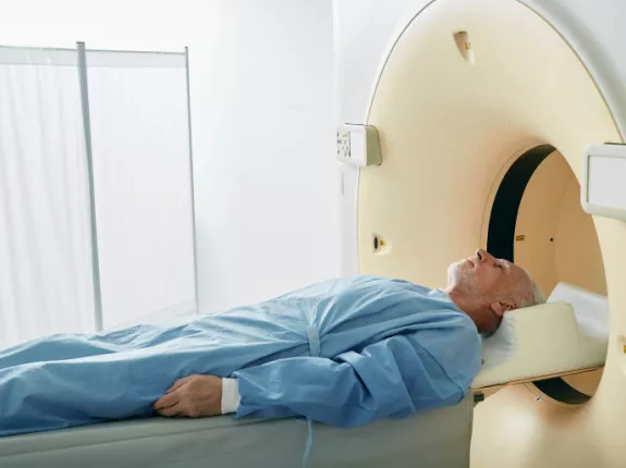 Man laying on table about to receive radiation