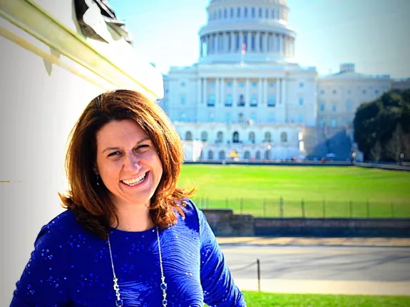 Stephanie Mueller at Capitol Hill in a bright blue dress