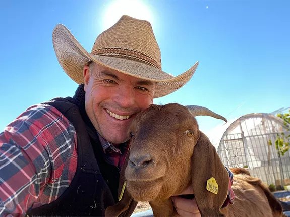 Cowboy Max and a goat