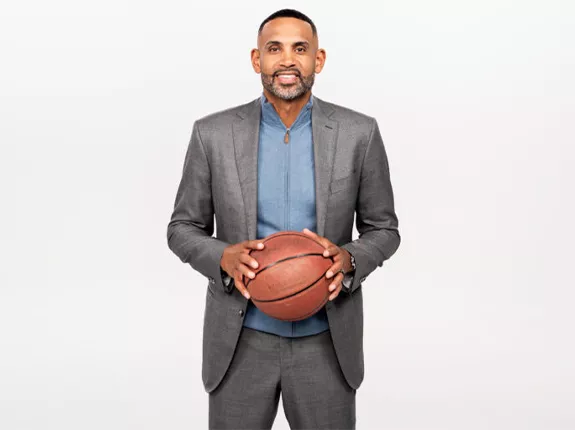 NBA All-Star Grant Hill holding a basketball